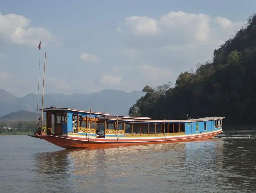 slow-boat-in-laos-18 - Laos Travel Company - Trips & Tours Slow Boat side view