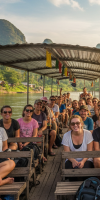 chiang-rai-to-laos-by-slow-boat Scenic view of travelers crossing the Mekong River from Chiang Rai to Laos